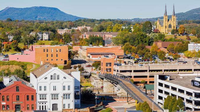 Small Town With Buildings, Rooftops And St. Andrews Catholic Church In The Background -- Roanoke Virginia High angle view of Roanoke Virginia with famous church in the background -- St Andrews Catholic Church.