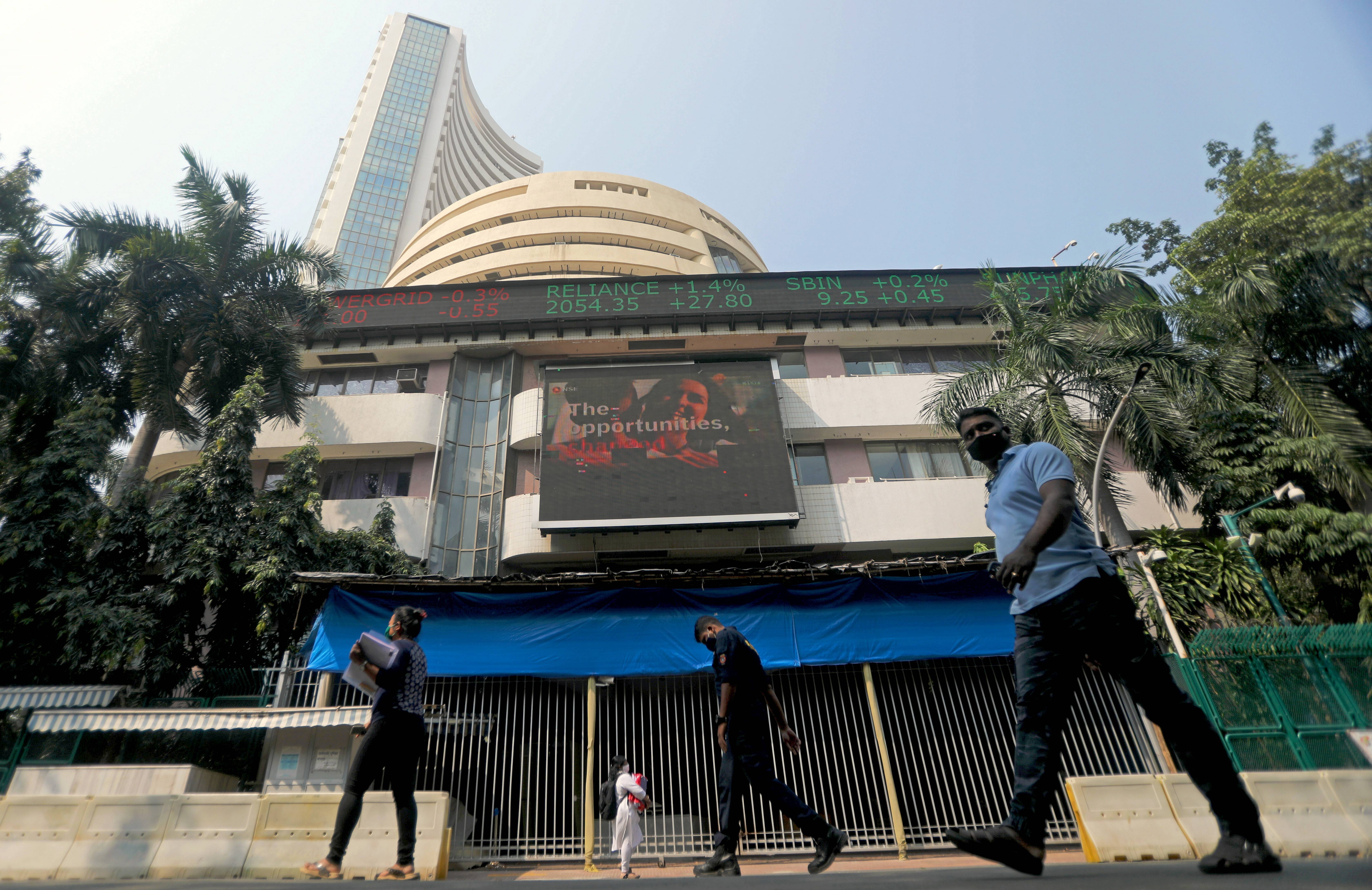 People walk past the Bombay Stock Exchange (BSE) building in Mumbai