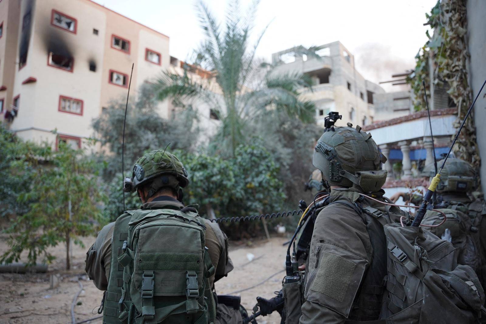 Israeli soldiers operate amid what the Israeli army says is the ongoing ground operation against the Palestinian Islamist group Hamas, in a location given as Gaza